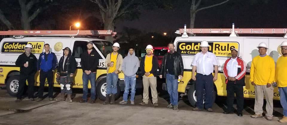 Golden Rule team in front of trucks